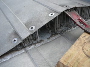 Why Is My Metal Roof Leaking? | Benchmark, Inc. Cedar Rapids, IA