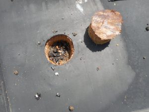 Corrosion of the Type A steel decking was discovered at this core sample.