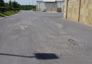 Premature failure caused in part by poor subgrade.